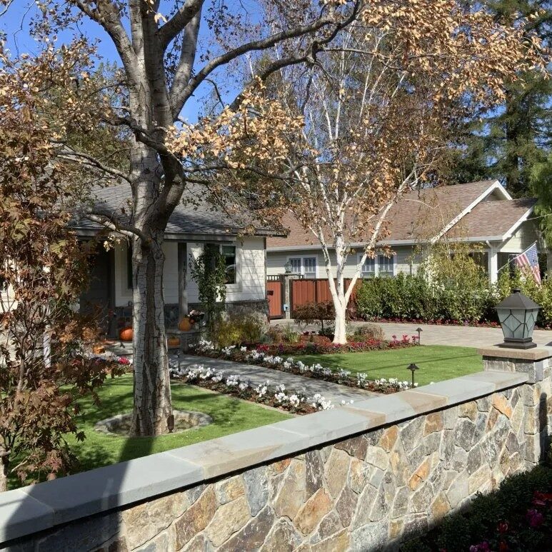 Custom stacked stone privacy wall with integrated pavers for a seamless walkway in Saratoga, CA, combining elegance and practicality for outdoor spaces.
